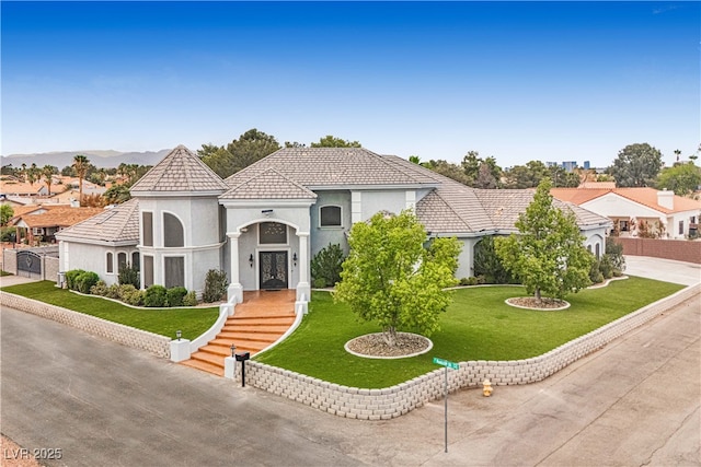 7751 Radcliff St, Las Vegas, NV 89123 - mediterranean / spanish-style home featuring a front yard, stucco siding, french doors, and a tiled roof
