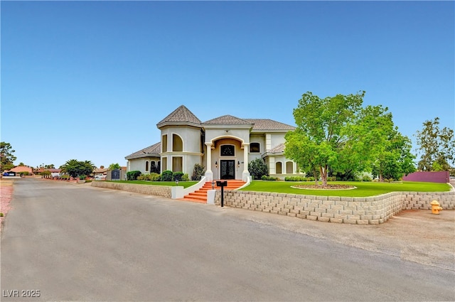 7751 Radcliff St, Las Vegas, NV 89123 - mediterranean / spanish house featuring a front yard and stucco siding