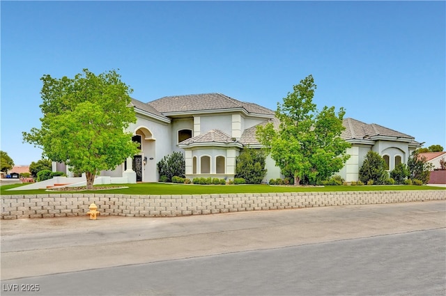 7751 Radcliff St, Las Vegas, NV 89123 - view of front facade featuring a front yard and stucco siding