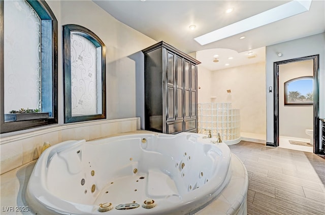 7751 Radcliff St, Las Vegas, NV 89123 - bathroom featuring a whirlpool tub, a walk in shower, and recessed lighting