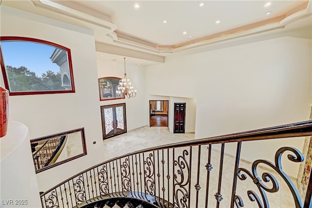 7751 Radcliff St, Las Vegas, NV 89123 - staircase with a chandelier, a tray ceiling, recessed lighting, and healthy amount of natural light