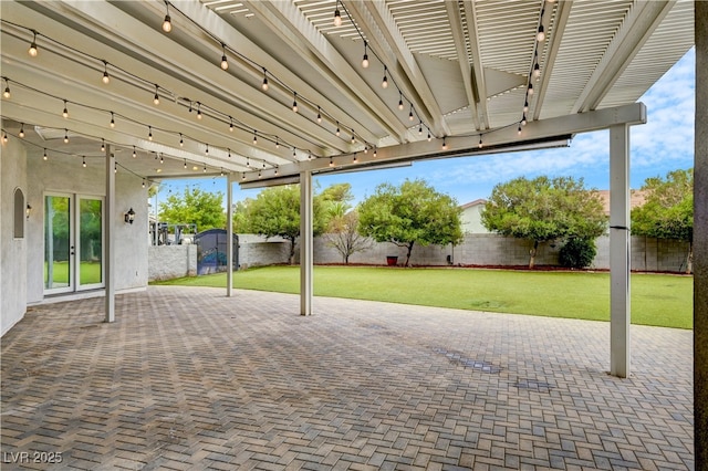 7751 Radcliff St, Las Vegas, NV 89123 - fenced backyard with a patio area and french doors