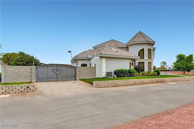 7751 Radcliff St, Las Vegas, NV 89123 - view of front facade featuring a gate, stucco siding, and concrete driveway