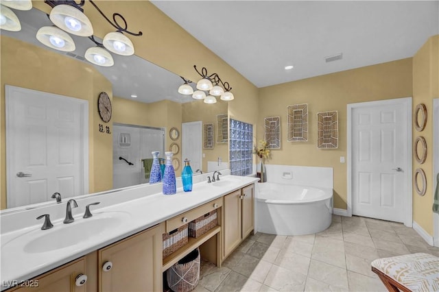 216 Chestnut Ridge Cir, Henderson, NV 89012 - bathroom with a freestanding bath, double vanity, and a walk in shower