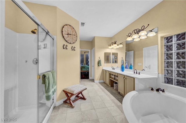 216 Chestnut Ridge Cir, Henderson, NV 89012 - full bathroom featuring a stall shower, double vanity, and a bath