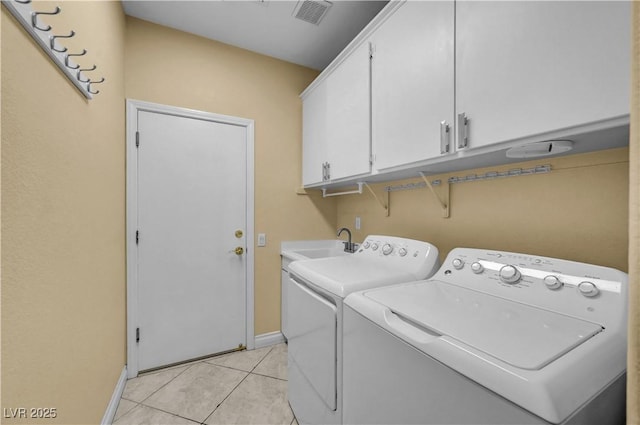 216 Chestnut Ridge Cir, Henderson, NV 89012 - washroom with cabinet space, washer and dryer, and light tile patterned floors