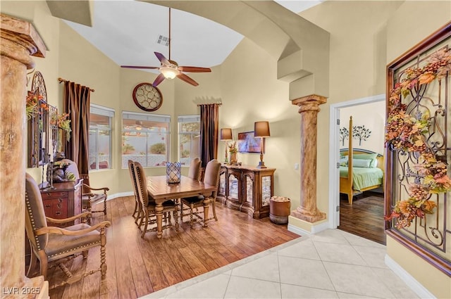 216 Chestnut Ridge Cir, Henderson, NV 89012 - tiled dining room with a ceiling fan, a towering ceiling, and decorative columns