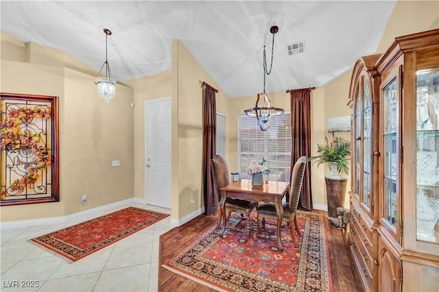 216 Chestnut Ridge Cir, Henderson, NV 89012 - tiled dining area featuring a chandelier and vaulted ceiling