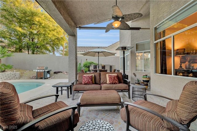 216 Chestnut Ridge Cir, Henderson, NV 89012 - fenced backyard with area for grilling, ceiling fan, a patio, and an outdoor living space