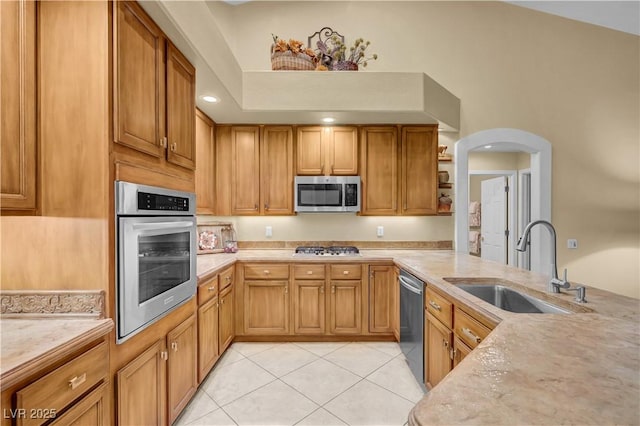 216 Chestnut Ridge Cir, Henderson, NV 89012 - kitchen featuring appliances with stainless steel finishes, light countertops, and light tile patterned floors