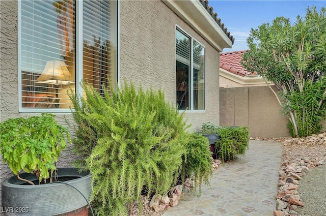 216 Chestnut Ridge Cir, Henderson, NV 89012 - view of property exterior with stucco siding and a tiled roof