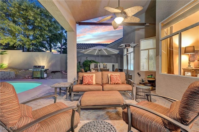 216 Chestnut Ridge Cir, Henderson, NV 89012 - fenced backyard with a grill, a patio, a ceiling fan, and an outdoor hangout area
