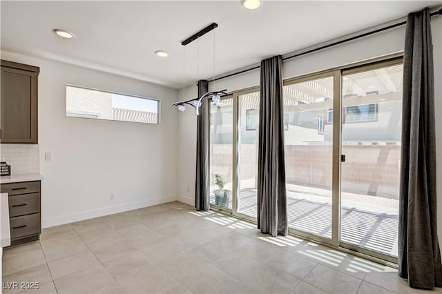 1305 Azure Jay Ave, North Las Vegas, NV 89084 - unfurnished dining area featuring light tile patterned flooring and recessed lighting