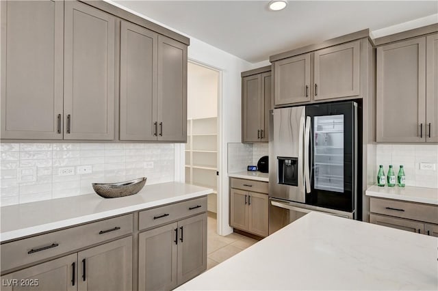 1305 Azure Jay Ave, North Las Vegas, NV 89084 - kitchen featuring stainless steel refrigerator with ice dispenser, backsplash, light countertops, and recessed lighting