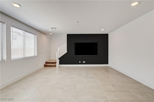 1305 Azure Jay Ave, North Las Vegas, NV 89084 - unfurnished living room with stairs, recessed lighting, and light tile patterned flooring