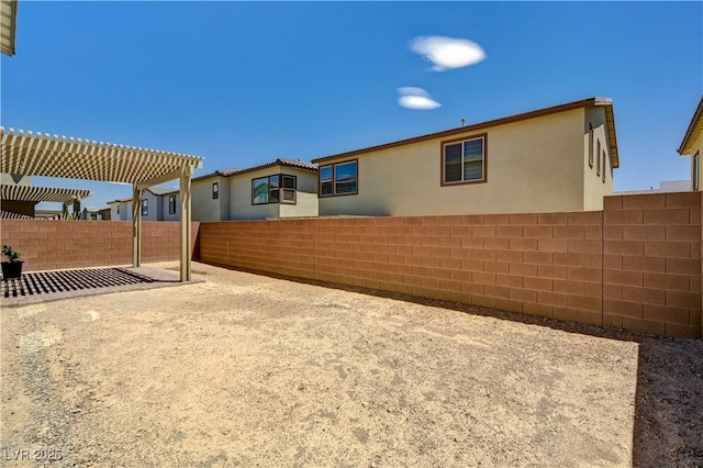 1305 Azure Jay Ave, North Las Vegas, NV 89084 - back of property featuring a fenced backyard, a pergola, and stucco siding