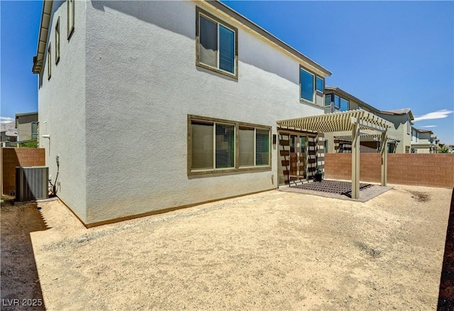 1305 Azure Jay Ave, North Las Vegas, NV 89084 - back of house featuring stucco siding, a fenced backyard, and a patio
