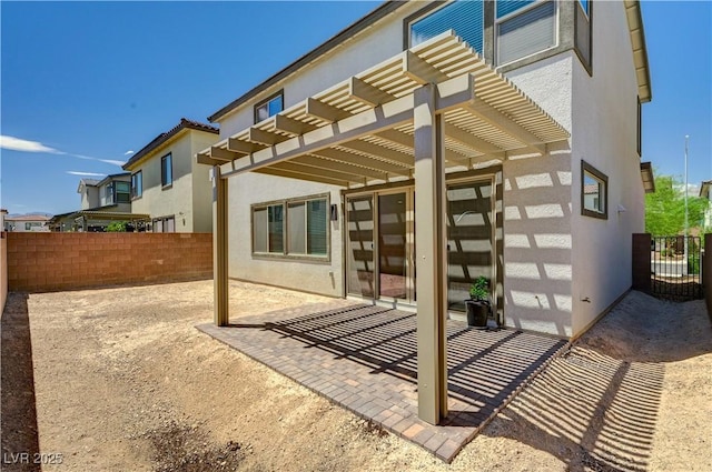 1305 Azure Jay Ave, North Las Vegas, NV 89084 - rear view of property featuring a pergola, a patio, and stucco siding