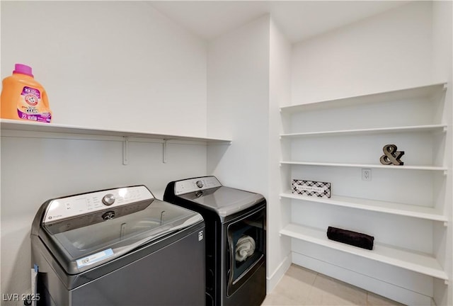 1305 Azure Jay Ave, North Las Vegas, NV 89084 - laundry area featuring washer and dryer and light tile patterned flooring
