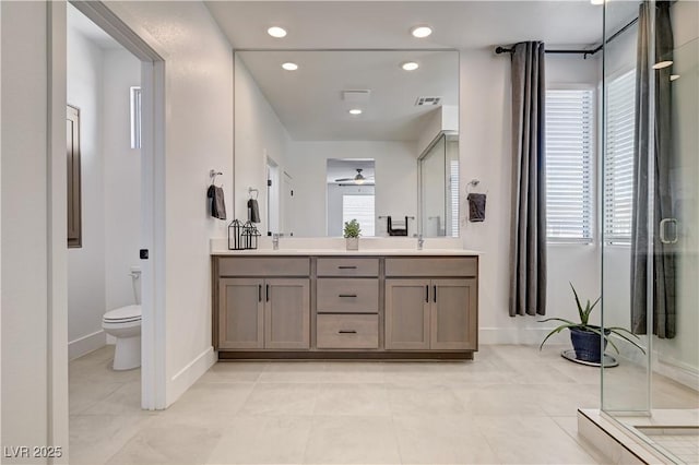 1305 Azure Jay Ave, North Las Vegas, NV 89084 - bathroom with double vanity, a ceiling fan, a shower stall, recessed lighting, and tile patterned floors