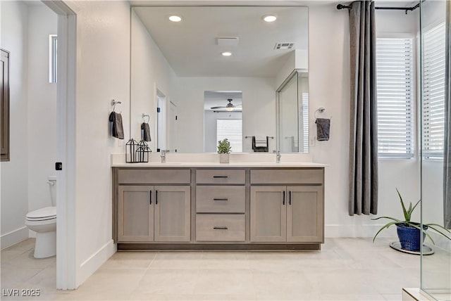 1305 Azure Jay Ave, North Las Vegas, NV 89084 - full bath featuring double vanity, ceiling fan, tile patterned floors, and recessed lighting