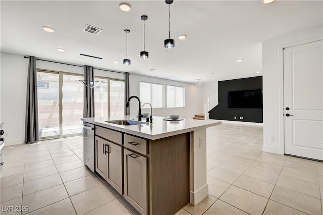 1305 Azure Jay Ave, North Las Vegas, NV 89084 - kitchen featuring light tile patterned floors, recessed lighting, decorative light fixtures, a center island with sink, and light countertops