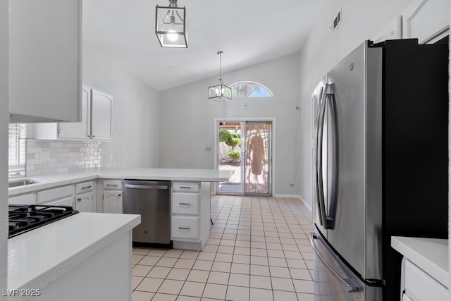 5621 Desert Creek Way, Las Vegas, NV 89149 - kitchen with stainless steel appliances, vaulted ceiling, light countertops, light tile patterned floors, and white cabinets