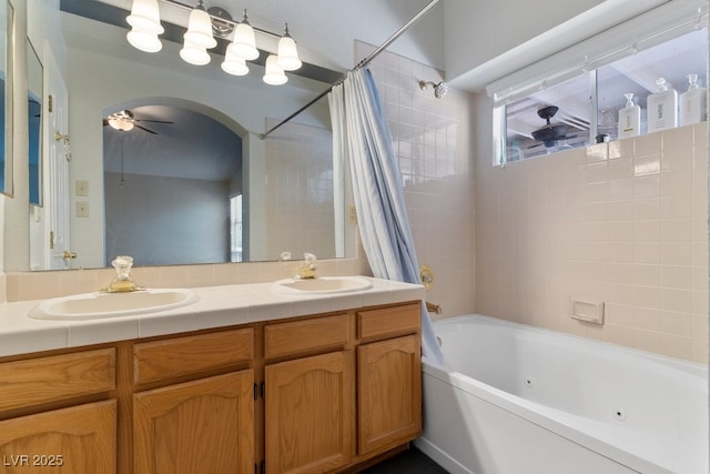 5621 Desert Creek Way, Las Vegas, NV 89149 - bathroom with a combined bath / shower with jetted tub, double vanity, and ceiling fan
