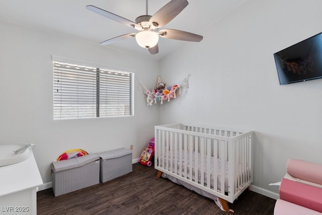 5621 Desert Creek Way, Las Vegas, NV 89149 - bedroom featuring a crib, wood finished floors, and ceiling fan