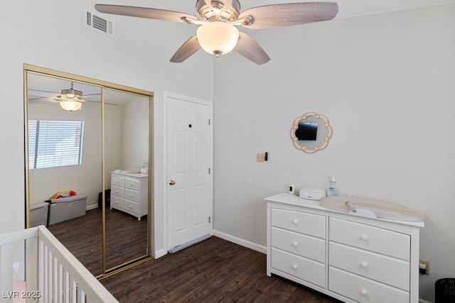 5621 Desert Creek Way, Las Vegas, NV 89149 - bedroom featuring dark wood-type flooring, a closet, and a ceiling fan