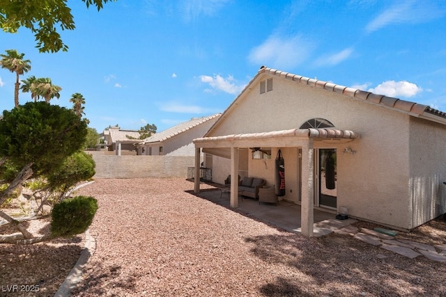 5621 Desert Creek Way, Las Vegas, NV 89149 - back of house with a patio, stucco siding, a fenced backyard, and an outdoor hangout area