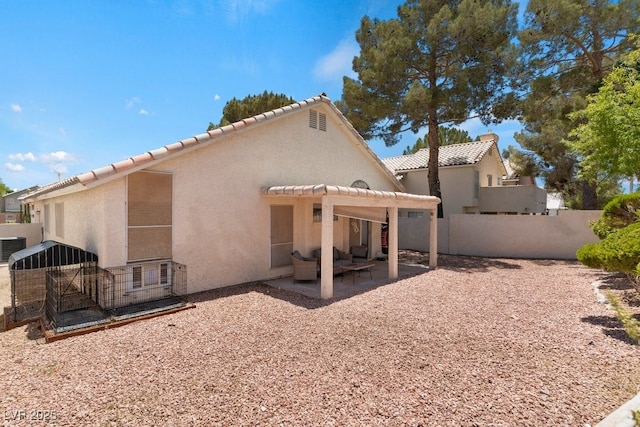 5621 Desert Creek Way, Las Vegas, NV 89149 - back of house with a tiled roof, stucco siding, a patio, and a pergola