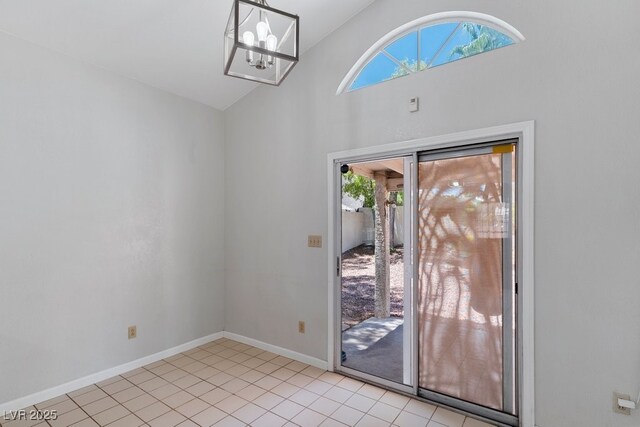 5621 Desert Creek Way, Las Vegas, NV 89149 - unfurnished room with plenty of natural light, a chandelier, light tile patterned flooring, and high vaulted ceiling