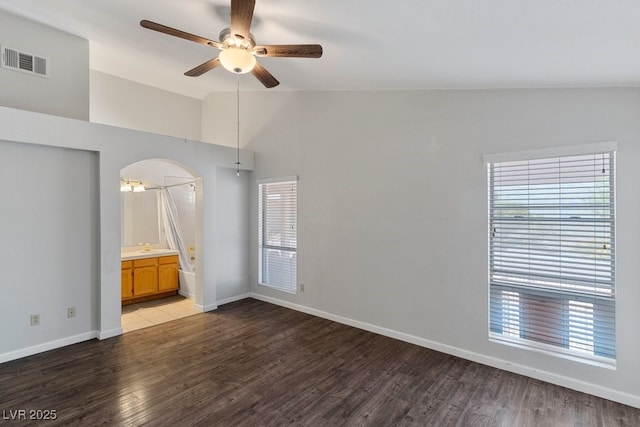 5621 Desert Creek Way, Las Vegas, NV 89149 - spare room featuring vaulted ceiling, a ceiling fan, light wood finished floors, and arched walkways