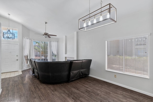 5621 Desert Creek Way, Las Vegas, NV 89149 - living area featuring wood finished floors, a chandelier, ceiling fan, and vaulted ceiling