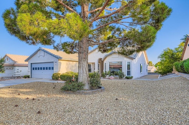5021 Cliffrose Dr, Las Vegas, NV 89130 - view of front facade with a garage, driveway, and stucco siding