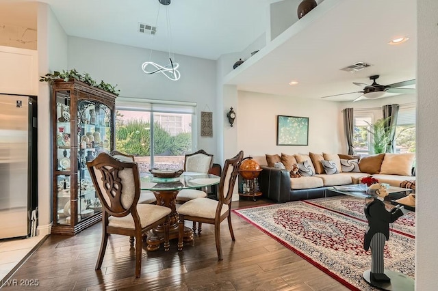 5021 Cliffrose Dr, Las Vegas, NV 89130 - dining space featuring healthy amount of natural light, wood finished floors, ceiling fan, and a chandelier