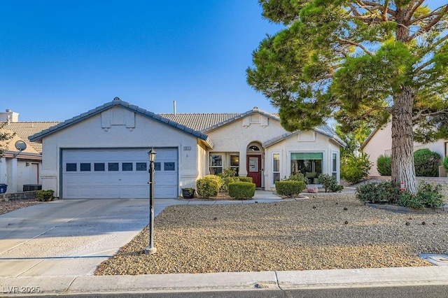 5021 Cliffrose Dr, Las Vegas, NV 89130 - view of front of property featuring stucco siding, driveway, a garage, and a tile roof
