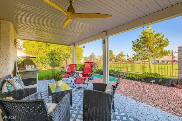5021 Cliffrose Dr, Las Vegas, NV 89130 - fenced backyard featuring a patio and ceiling fan