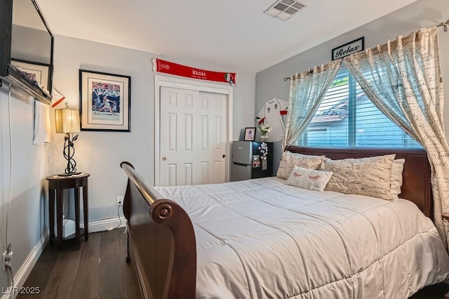 5021 Cliffrose Dr, Las Vegas, NV 89130 - bedroom featuring dark wood-type flooring and a closet