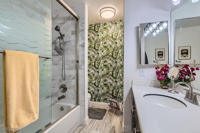5021 Cliffrose Dr, Las Vegas, NV 89130 - bathroom featuring wallpapered walls, vanity, wood finished floors, and shower / bathtub combination
