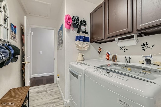 5021 Cliffrose Dr, Las Vegas, NV 89130 - laundry room with separate washer and dryer, cabinet space, light wood finished floors, and attic access
