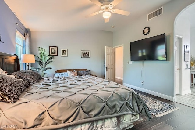 5021 Cliffrose Dr, Las Vegas, NV 89130 - bedroom with vaulted ceiling, arched walkways, and a ceiling fan