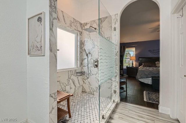 5021 Cliffrose Dr, Las Vegas, NV 89130 - ensuite bathroom with a marble finish shower, wood finished floors, and a ceiling fan