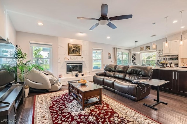 5021 Cliffrose Dr, Las Vegas, NV 89130 - living area with wood finished floors, a ceiling fan, healthy amount of natural light, recessed lighting, and vaulted ceiling