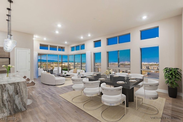 4152 Yucca Bloom St Unit 1, Las Vegas, NV 89135 - dining room featuring recessed lighting and wood finished floors