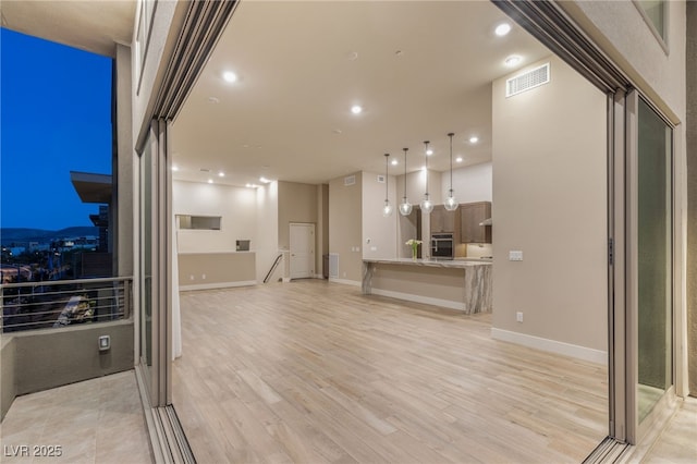 4152 Yucca Bloom St Unit 1, Las Vegas, NV 89135 - unfurnished living room featuring light wood-style flooring and recessed lighting