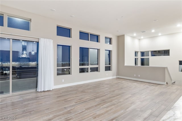 4152 Yucca Bloom St Unit 1, Las Vegas, NV 89135 - unfurnished room featuring wood finished floors and recessed lighting