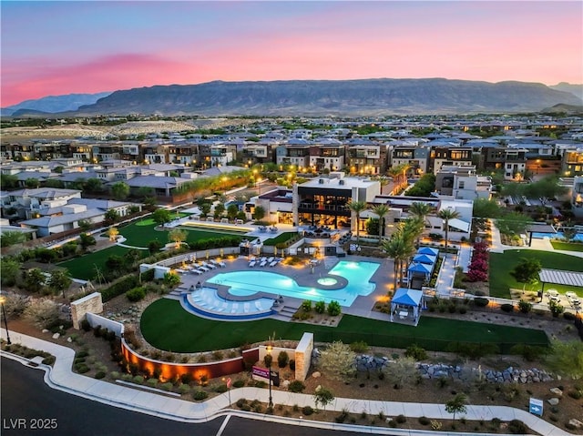 4152 Yucca Bloom St Unit 1, Las Vegas, NV 89135 - aerial view at dusk of a mountain view, view of pool, and a residential view