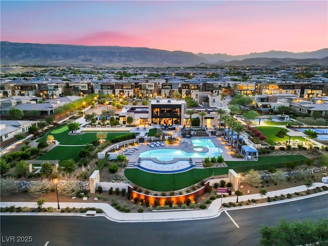 4152 Yucca Bloom St Unit 1, Las Vegas, NV 89135 - aerial view at dusk of a mountain view and view of pool